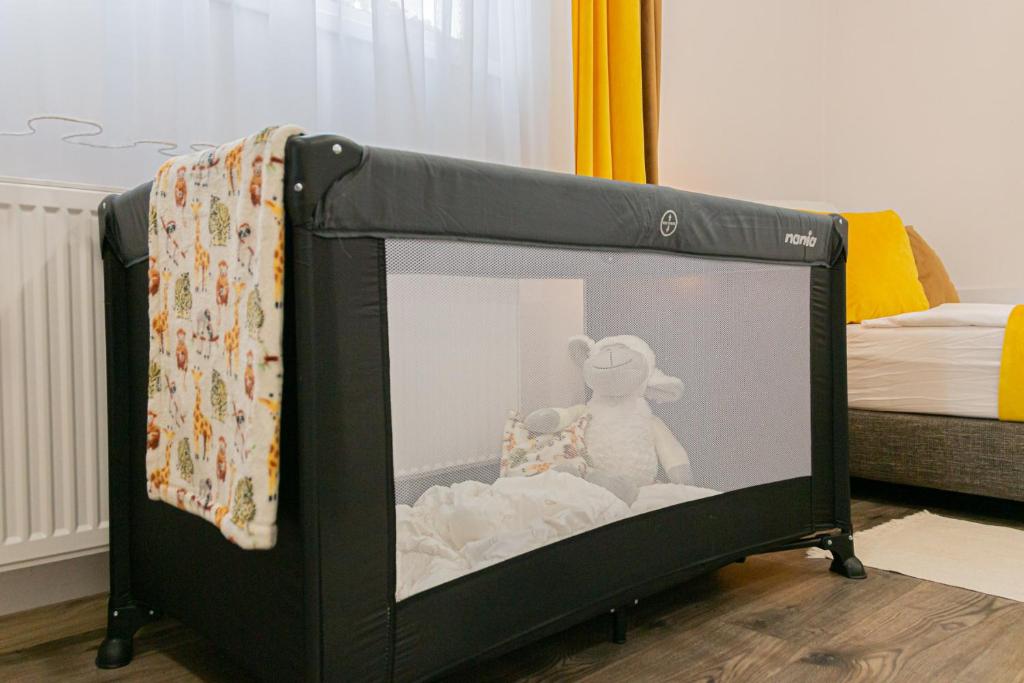 Łóżko lub łóżka w pokoju w obiekcie Hagyma Panzió