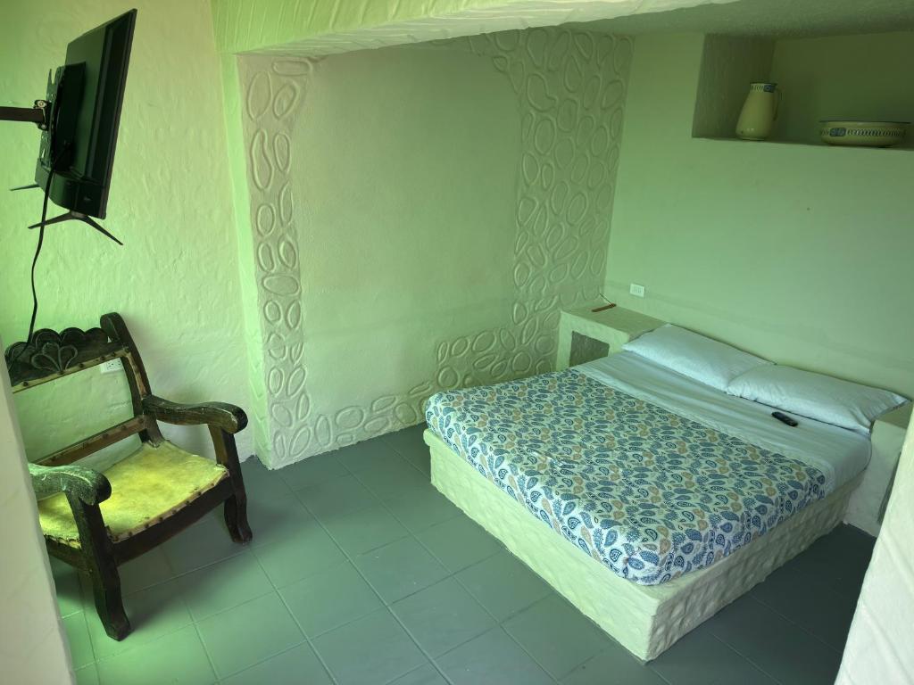 Una cama o camas en una habitación de Jaragual EcoHostel