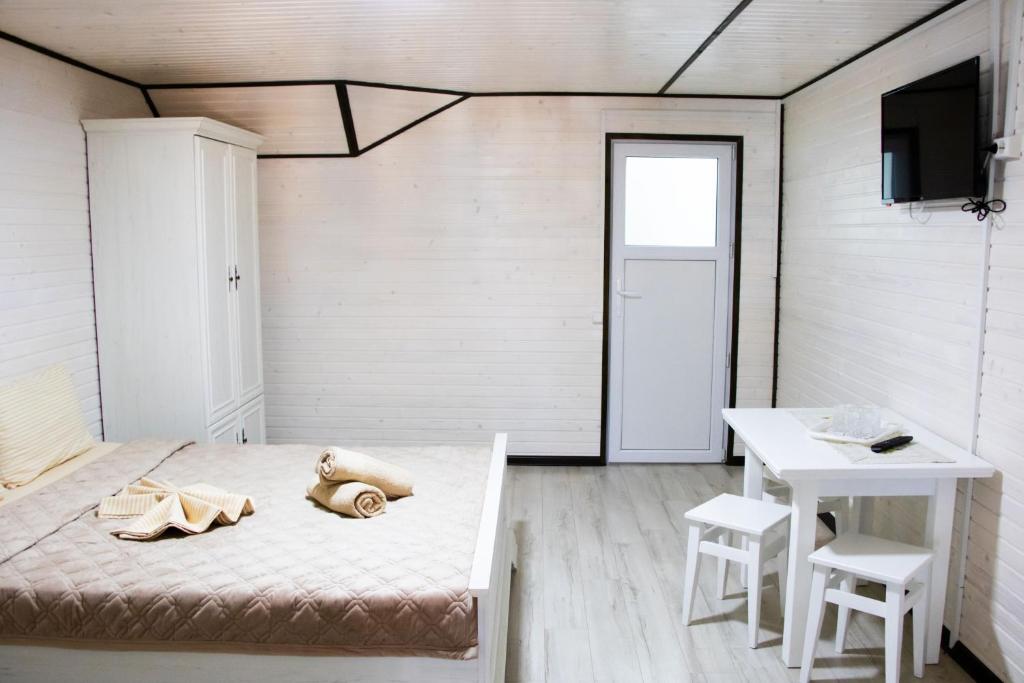 Postel nebo postele na pokoji v ubytování Hotel BILYI AIST