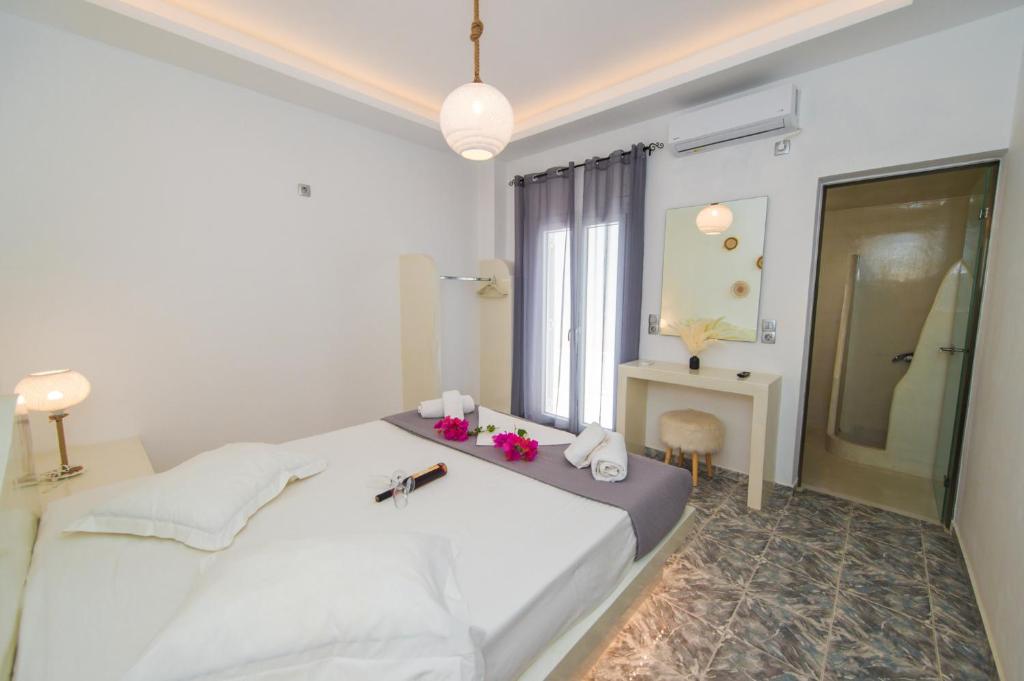 Postel nebo postele na pokoji v ubytování The F Suites