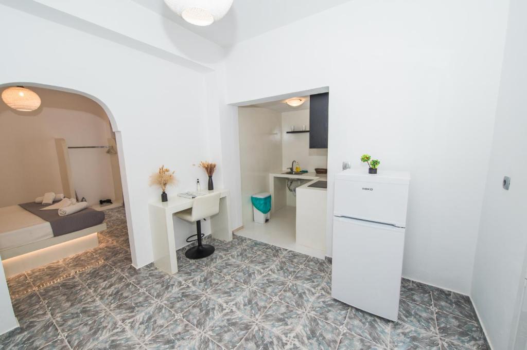 Kuchyň nebo kuchyňský kout v ubytování The F Suites