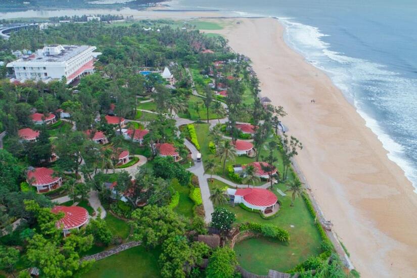 an aerial view of a resort next to the beach at Taj Fisherman’s Cove Resort &amp; Spa, Chennai in Mahabalipuram