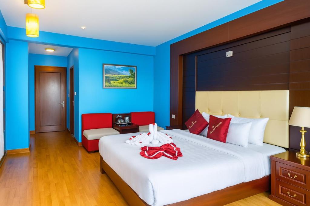 Postel nebo postele na pokoji v ubytování Sapa Elegance Hotel