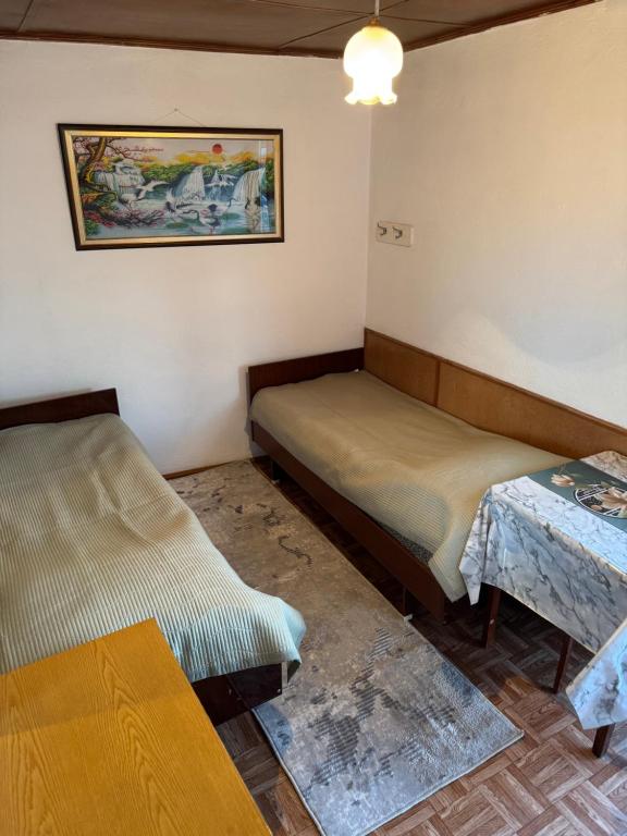 Postel nebo postele na pokoji v ubytování Kosmos