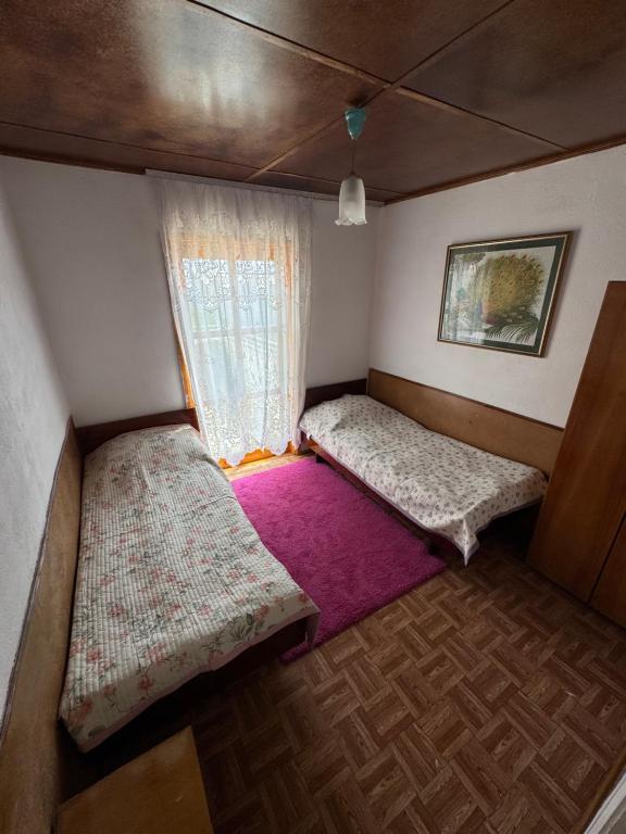 Postel nebo postele na pokoji v ubytování Kosmos