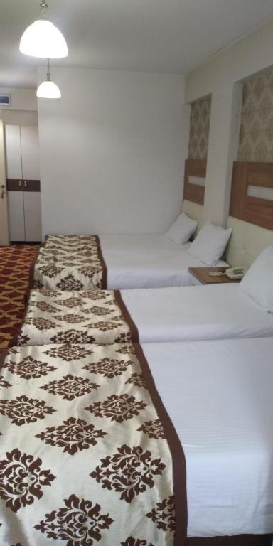 Postel nebo postele na pokoji v ubytování Afyon Grand Arı Hotel