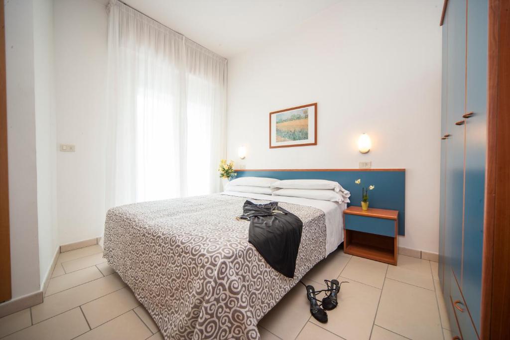 Postel nebo postele na pokoji v ubytování Hotel Taormina