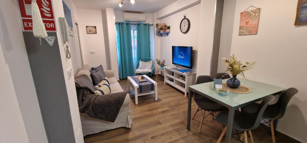 Televízia a/alebo spoločenská miestnosť v ubytovaní mi apartamento 60