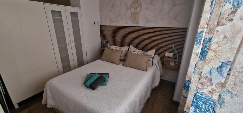 Posteľ alebo postele v izbe v ubytovaní mi apartamento 60