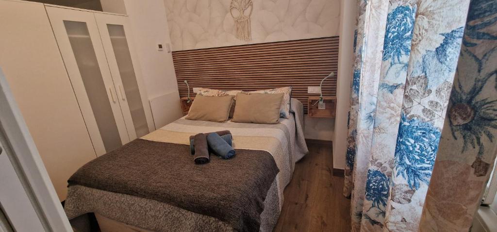 Posteľ alebo postele v izbe v ubytovaní mi apartamento 60