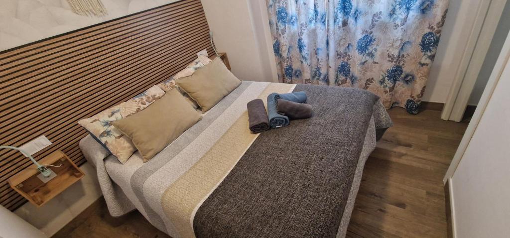 Posteľ alebo postele v izbe v ubytovaní mi apartamento 60