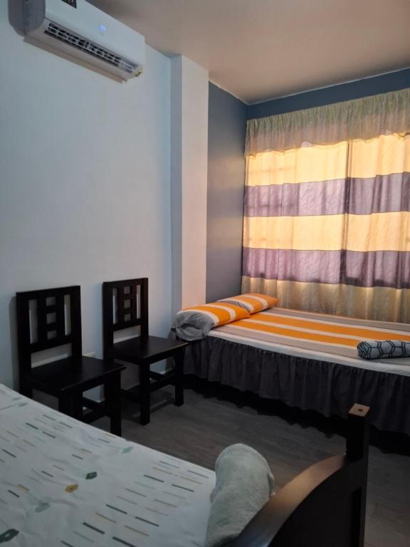 Postel nebo postele na pokoji v ubytování Casa Alexita