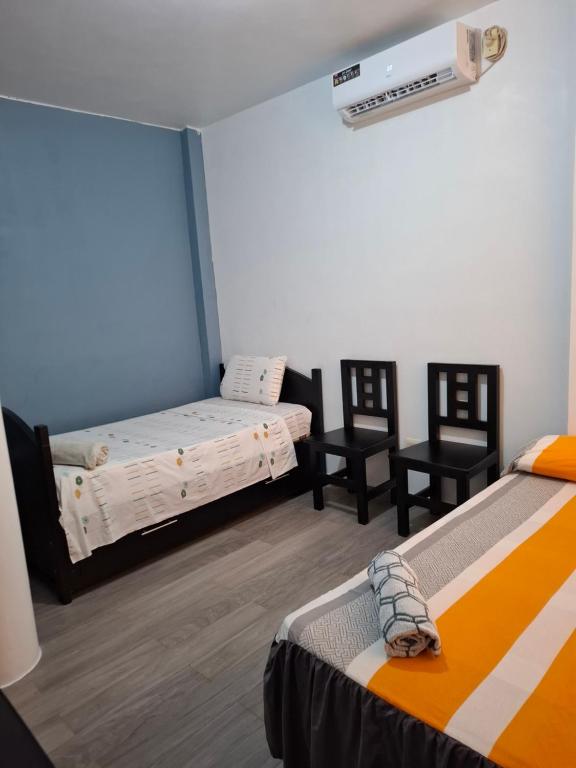 Postel nebo postele na pokoji v ubytování Casa Alexita