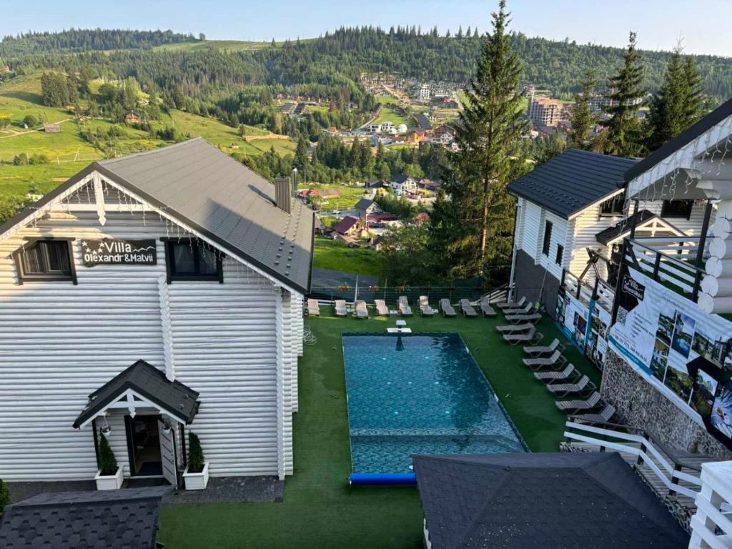 an aerial view of a backyard with a swimming pool at Villa Olexandr&Matvii in Bukovel