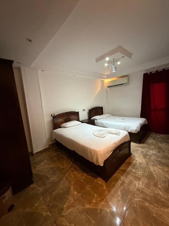 Postel nebo postele na pokoji v ubytování Sphinx Middle East