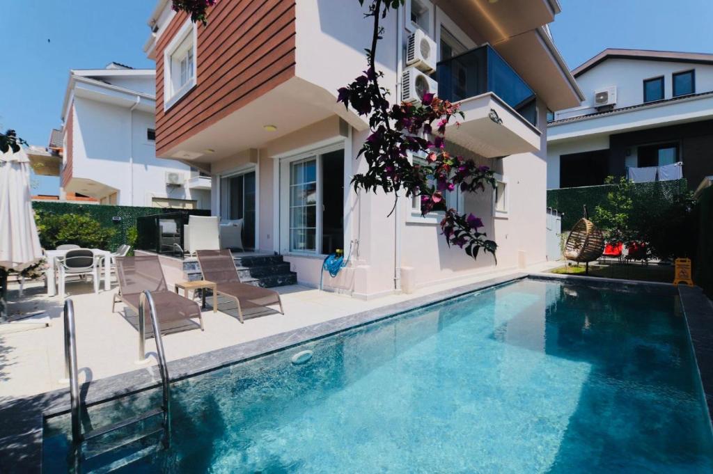 a swimming pool in the backyard of a house at YeldA in Fethiye