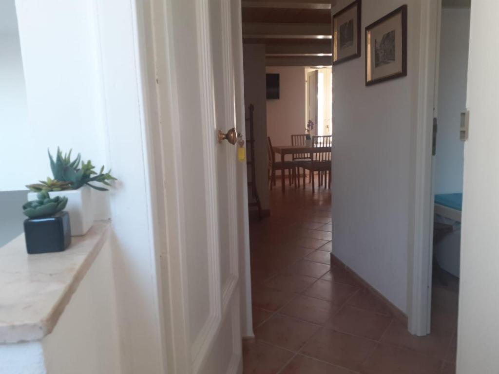 an open door to a hallway with a dining room at Da Massimo in Cefalù