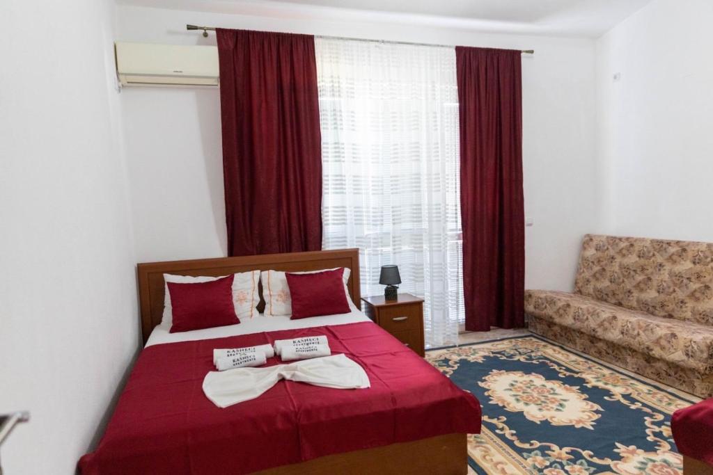 Postel nebo postele na pokoji v ubytování Kasneci Apartments
