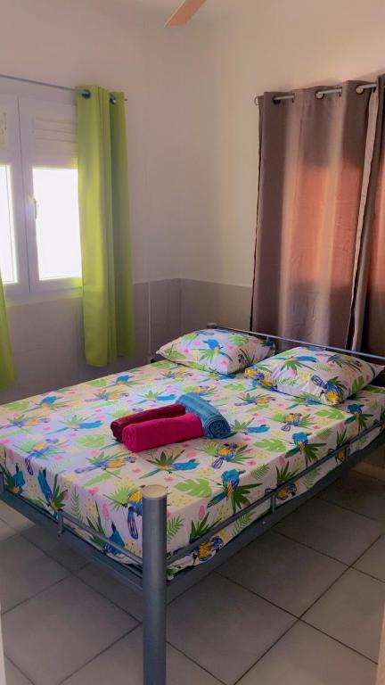 Postel nebo postele na pokoji v ubytování Maison tartanaise