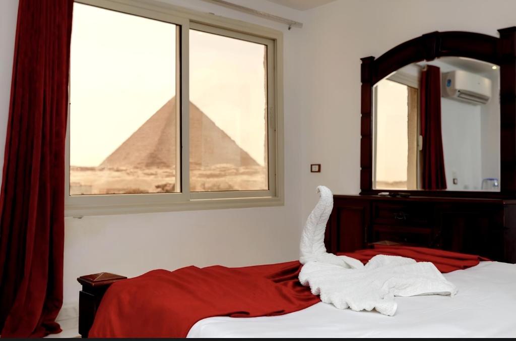 Postel nebo postele na pokoji v ubytování Sphinx Middle East