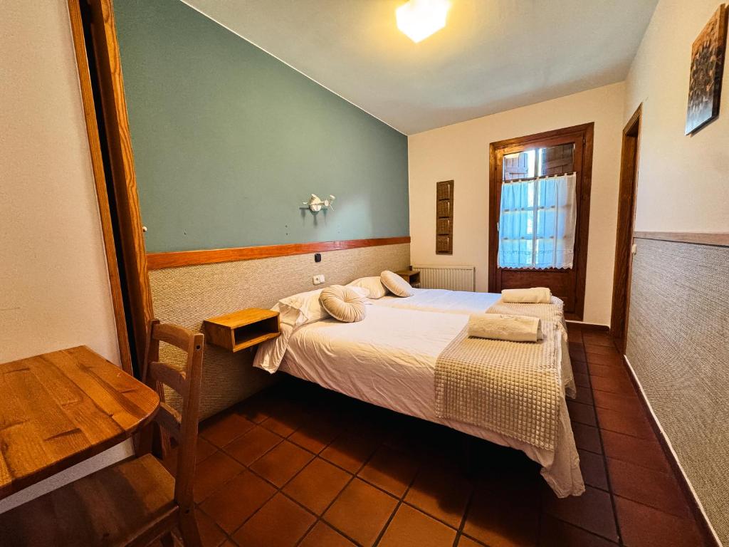 Postel nebo postele na pokoji v ubytování Hotel de Montaña Uson