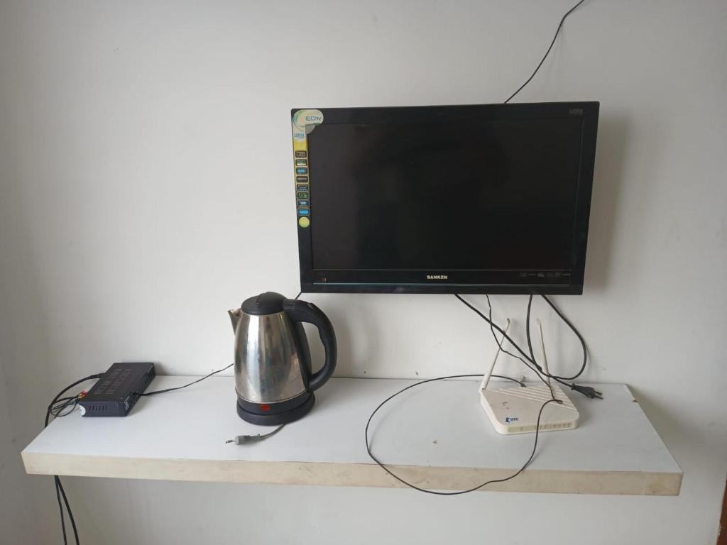 Μια τηλεόραση ή/και κέντρο ψυχαγωγίας στο Room Family Room Cengkareng