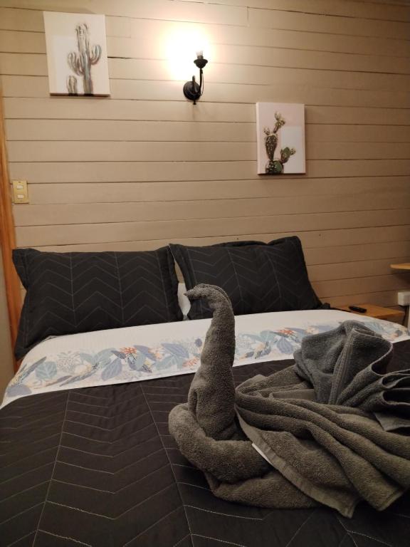 Habitacion Arrayan房間的床