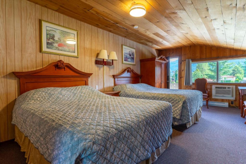 Postel nebo postele na pokoji v ubytování Richca Chalets Resort