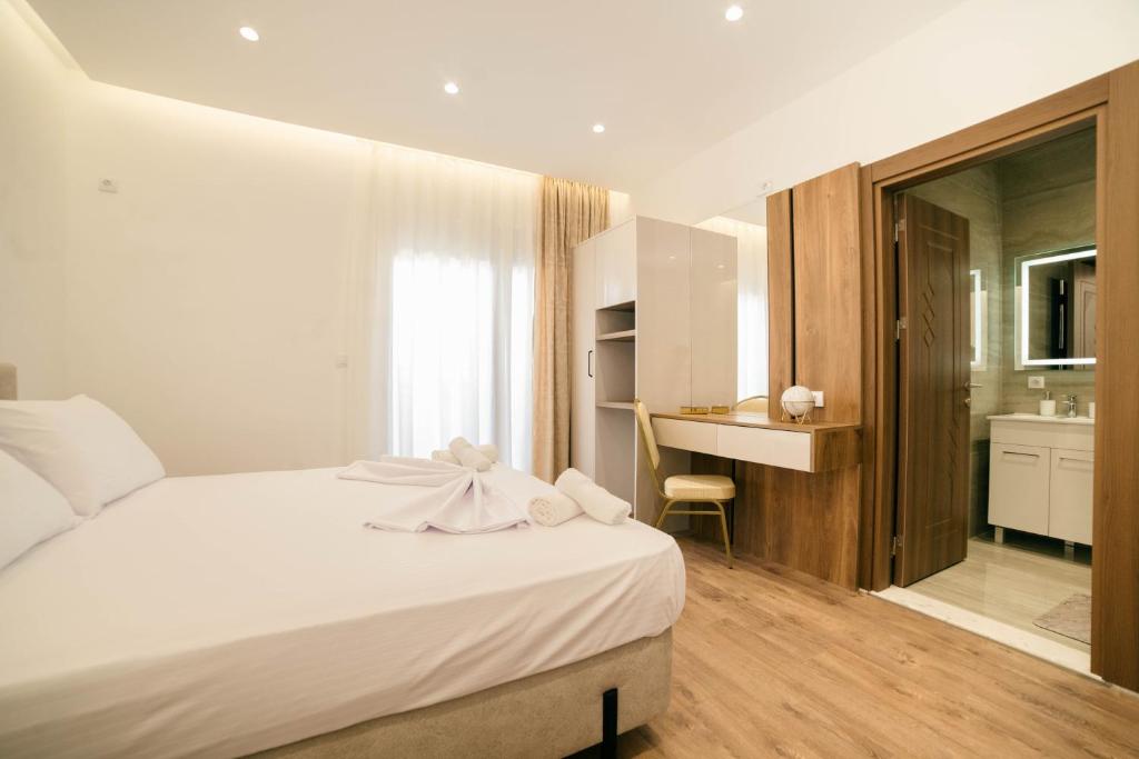 Ένα ή περισσότερα κρεβάτια σε δωμάτιο στο Hotel Ajana