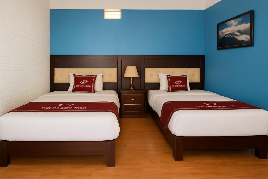 Postel nebo postele na pokoji v ubytování Sapa Elegance Hotel