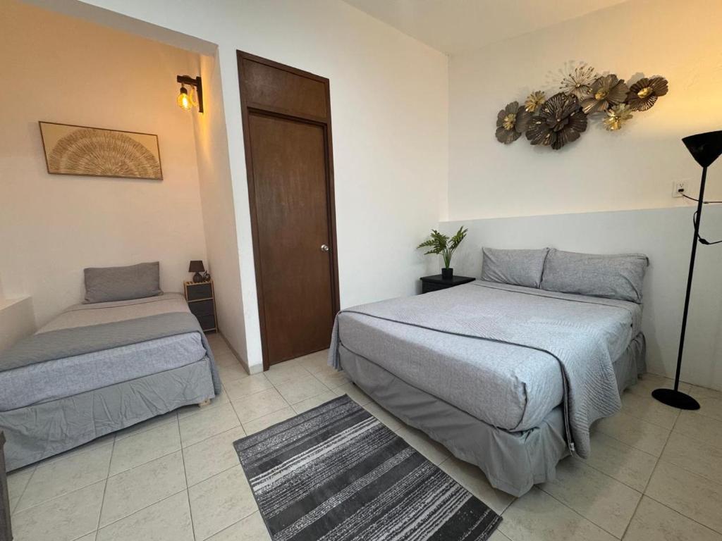 Postel nebo postele na pokoji v ubytování Casa Lua by Ambar