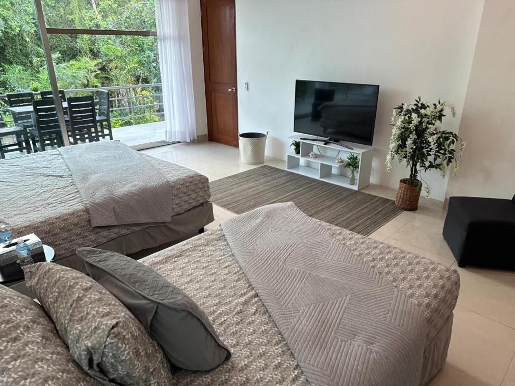 TV a/nebo společenská místnost v ubytování Casa Lua by Ambar