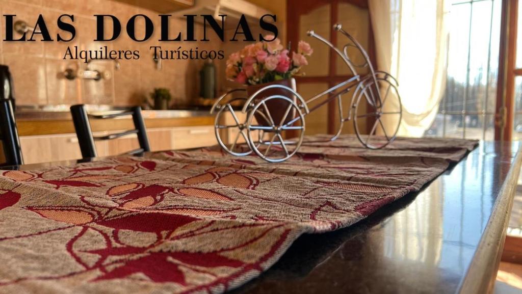 a table with a table cloth on top of it at Las Dolinas 3 in Malargüe