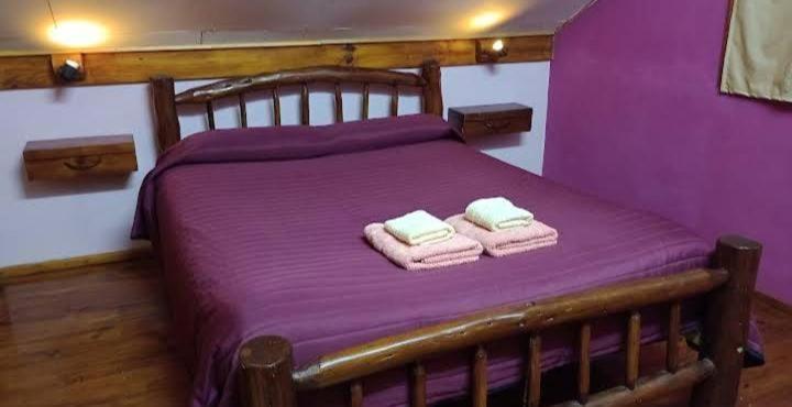 Postel nebo postele na pokoji v ubytování Cabaña La Aurora Cabañas Lu-Mau