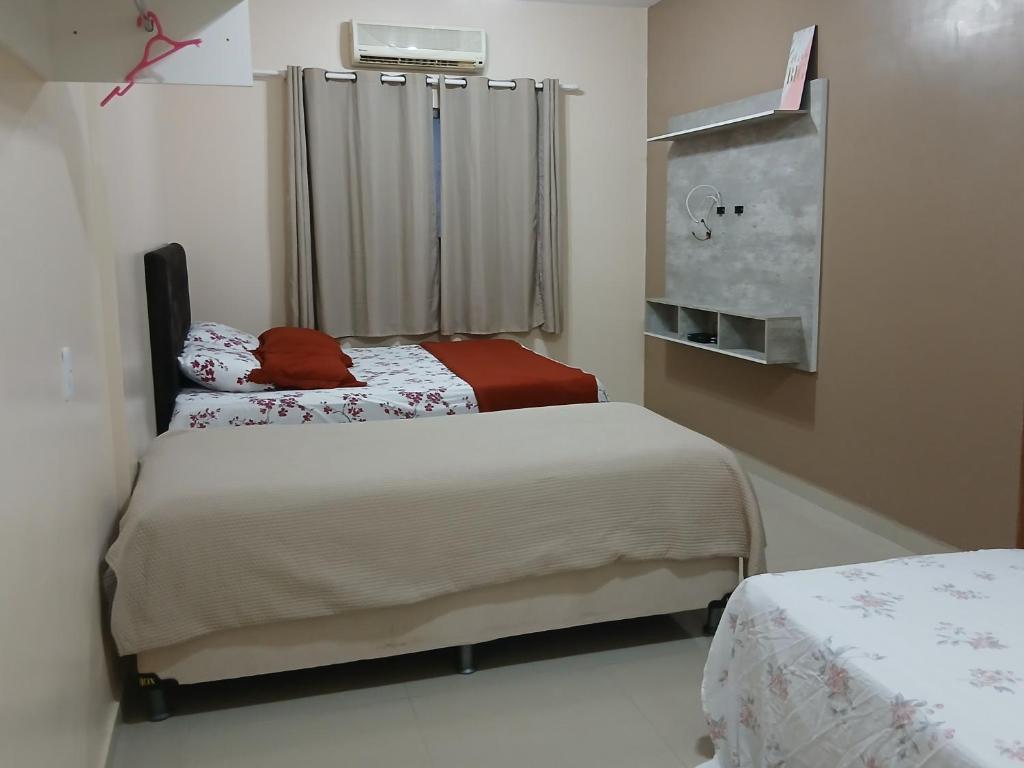 En eller flere senge i et værelse på Casa 5 quartos Aluguel Temporada Residencial Mirandinha