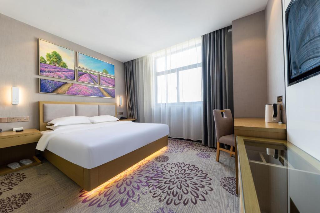 Voodi või voodid majutusasutuse Michael Fashion Hotel toas