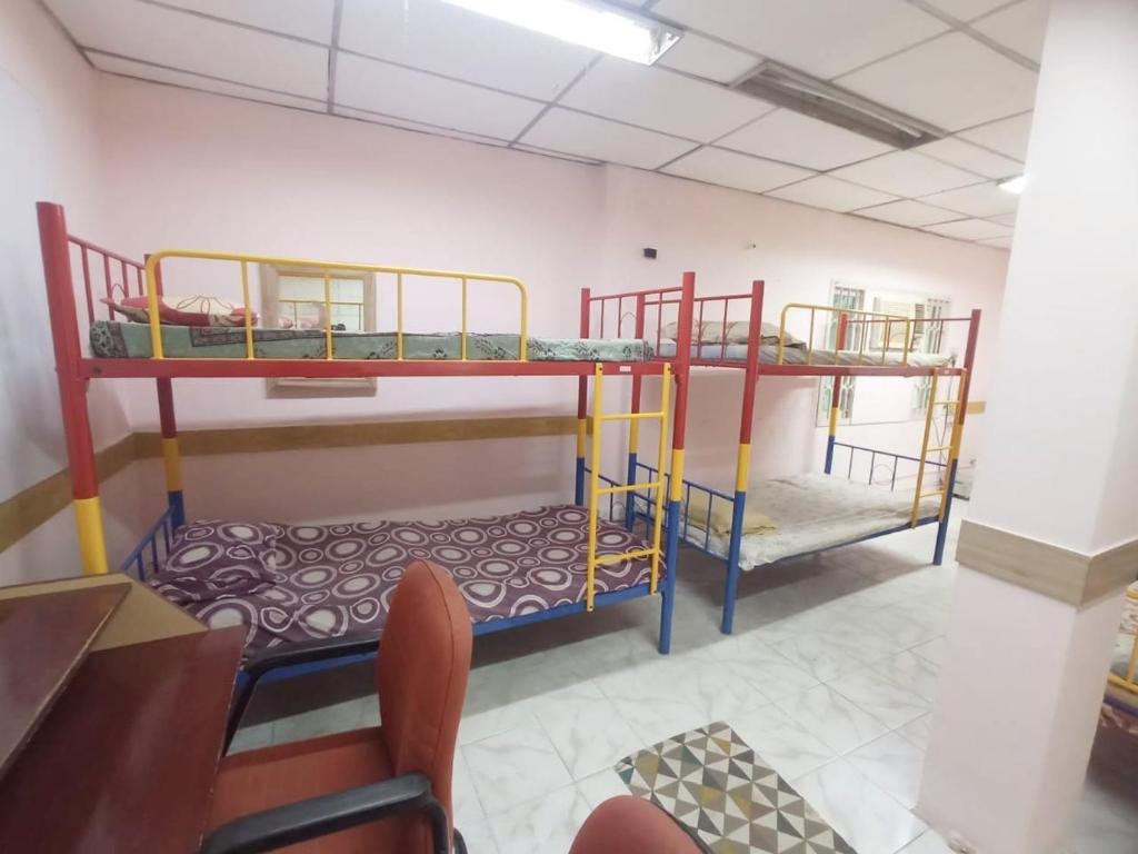 Postel nebo postele na pokoji v ubytování WISHTREE CORPORATE MENS DORMITORY FOR TECHIES AND Trainees