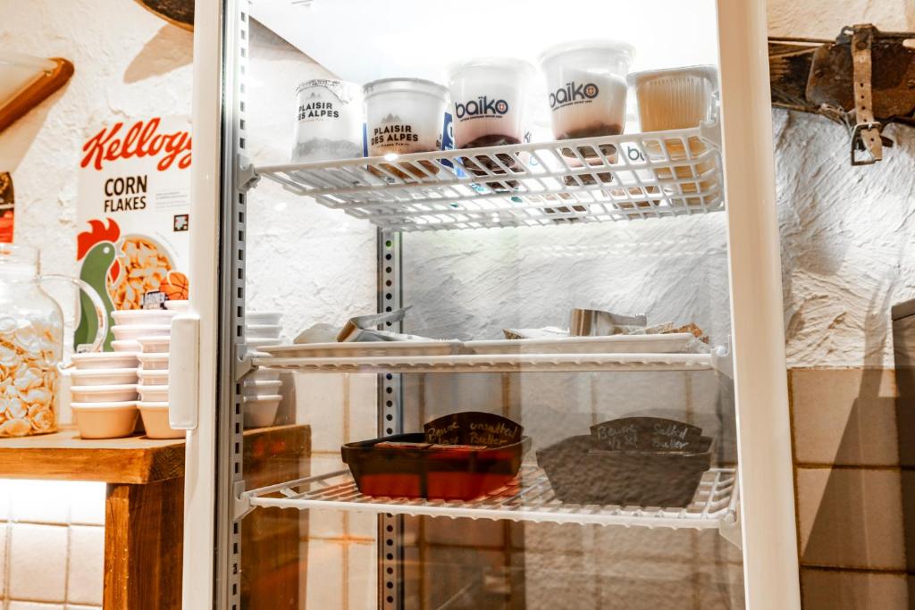 a refrigerator filled with lots of food at Les Glières - Champagny-en-Vanoise in Champagny-en-Vanoise