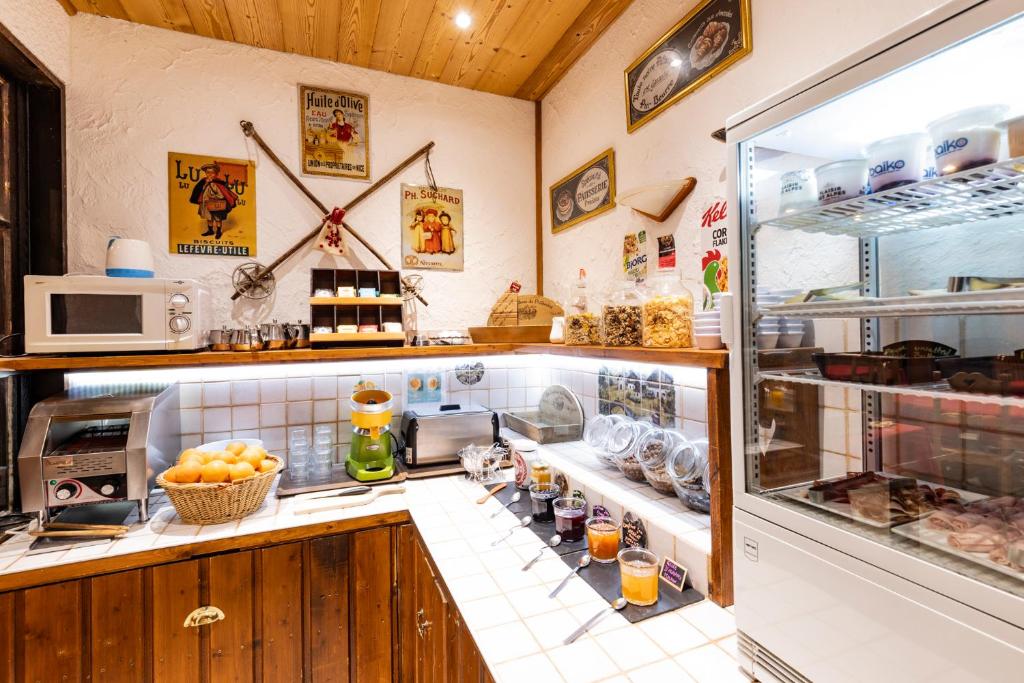 a kitchen with a counter with some food at Les Glières - Champagny-en-Vanoise in Champagny-en-Vanoise