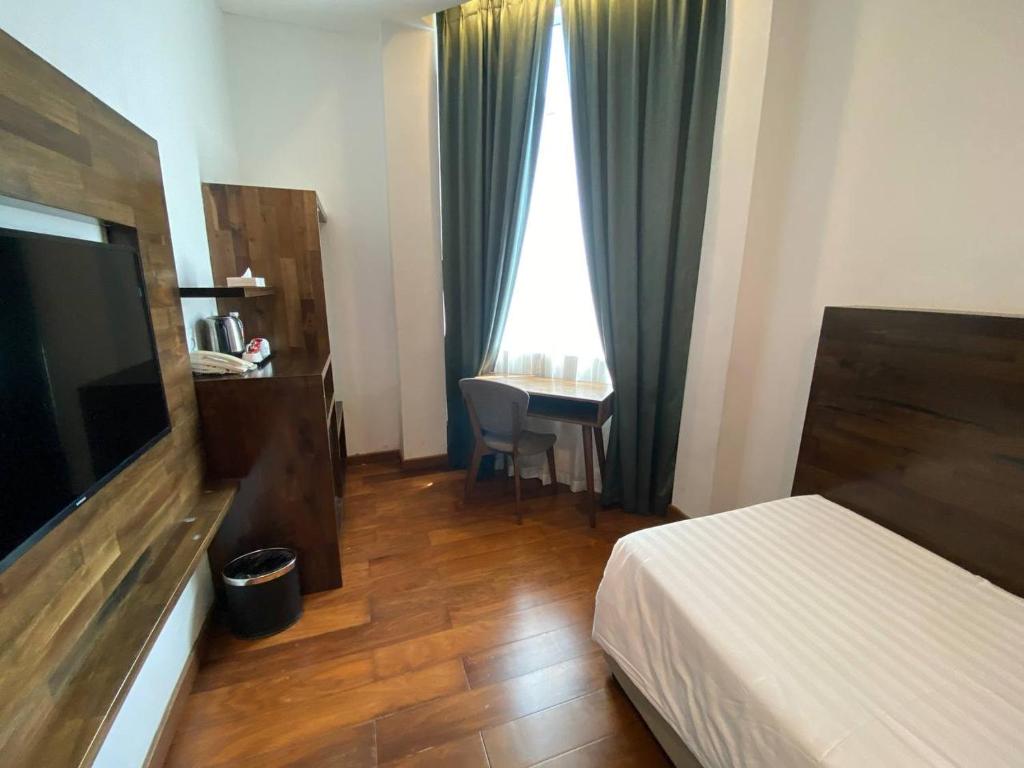 Postel nebo postele na pokoji v ubytování Serapi Hotel