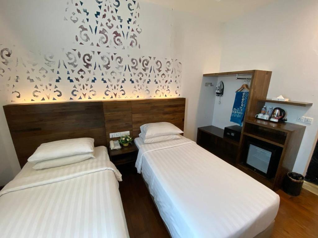 Postel nebo postele na pokoji v ubytování Serapi Hotel