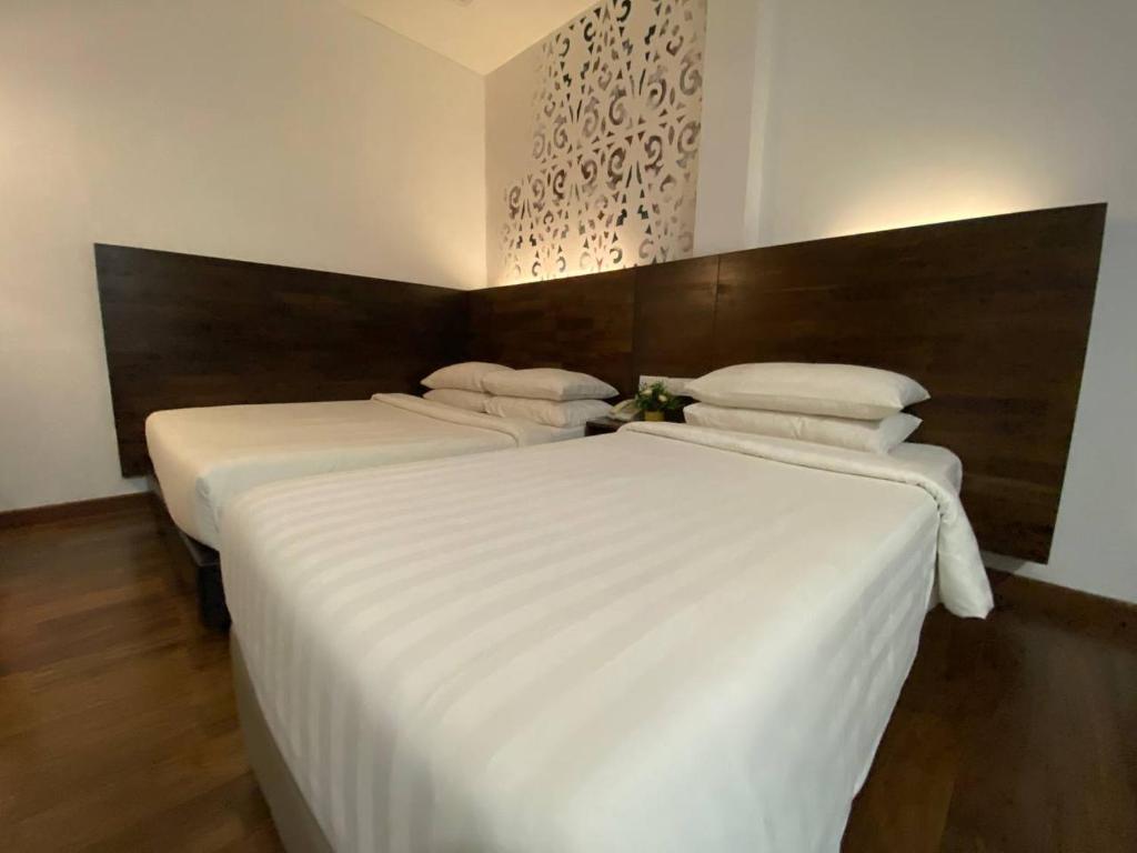 Postel nebo postele na pokoji v ubytování Serapi Hotel
