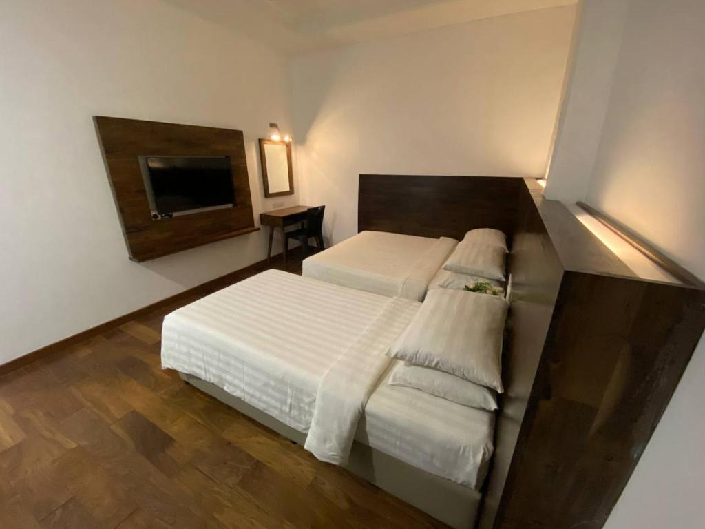 Postel nebo postele na pokoji v ubytování Serapi Hotel