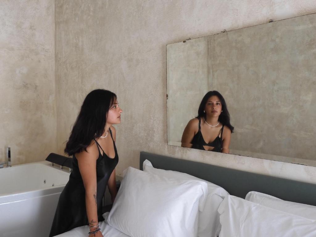 Postel nebo postele na pokoji v ubytování P43 Sicilian Suites