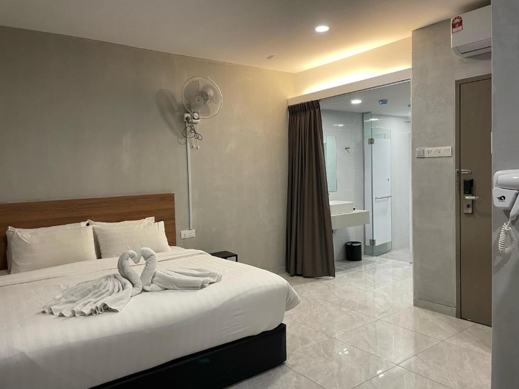 Postel nebo postele na pokoji v ubytování HPY Hotel