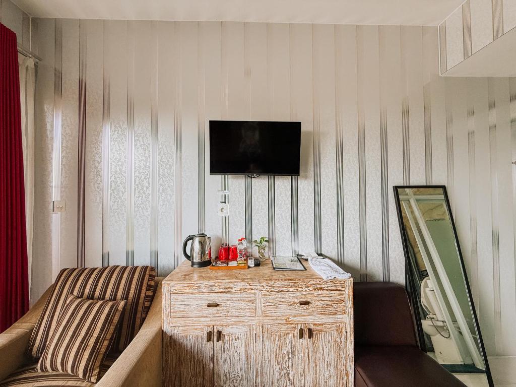 TV a/nebo společenská místnost v ubytování Bhuana Agung Villa and Restaurant