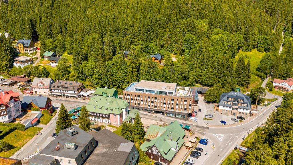 an aerial view of a small town in the woods at Soukromý Apartmán PVV Pec in Pec pod Sněžkou