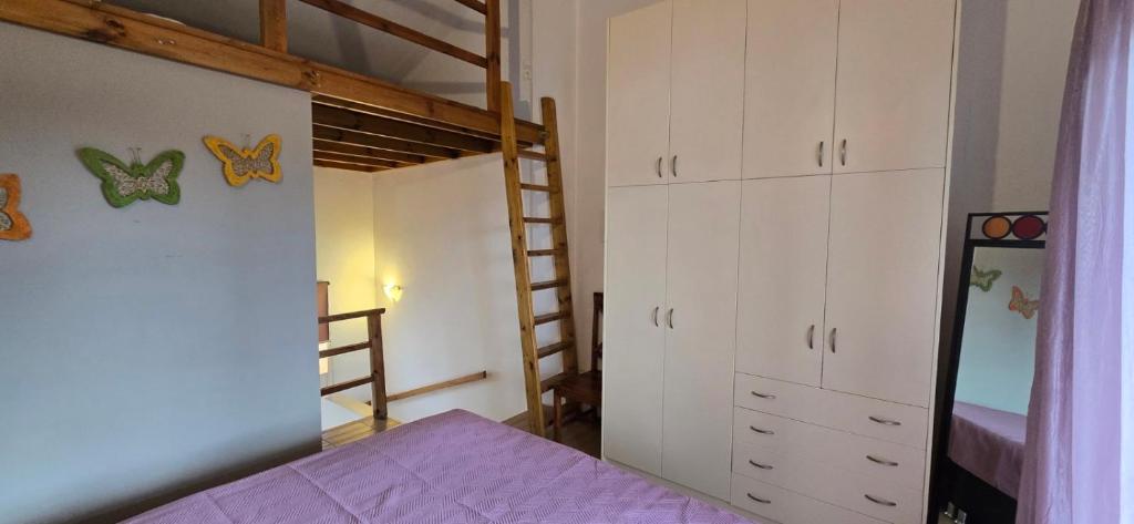 Posteľ alebo postele v izbe v ubytovaní Rafaella's Maisonette at Rafaella Resort