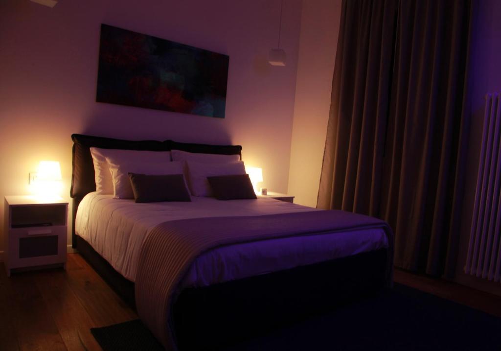 Una cama o camas en una habitación de B&B Massimo Inn