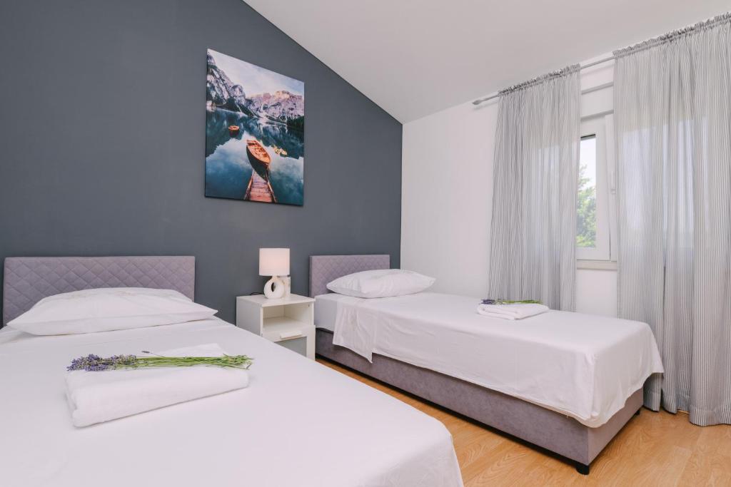 Posteľ alebo postele v izbe v ubytovaní Apartment Ljubica